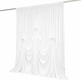 White sheer draped curtain panel on rod, elegant minimalist backdrop