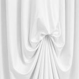 White draped curtain with elegant fabric folds and soft shadows#whtbkgd