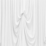 White draped fabric backdrop with soft gathered folds and elegant texture