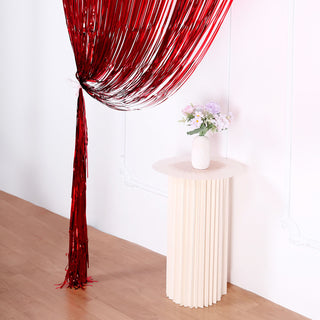 Create a Dazzling Party Backdrop with the 8ft Red Metallic Tinsel Foil Fringe Doorway Curtain
