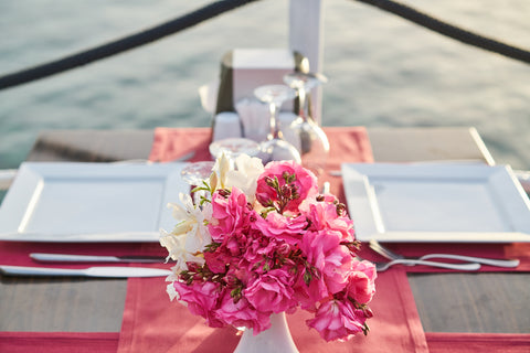 Pink floral bouquet on a table setting