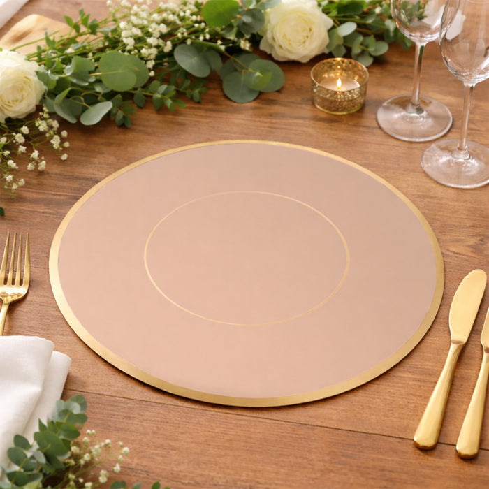 Elegant round placemat with gold rim on a wooden table setting.