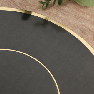 Black and gold decorative plate on textured background.