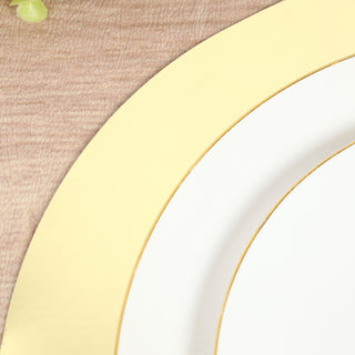 Elegant white plate with gold rim on textured wood background.