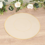Round gold-trimmed placemat on a wooden surface with floral decor.
