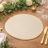 Elegant round gold-trimmed placemat on a wooden table with floral decor.