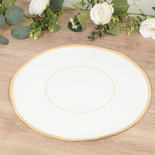 Elegant white plate with gold rim on wooden table.