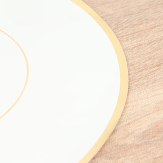 Elegant white plate with gold trim on a wooden surface.