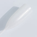 White champagne flute on a plain background.