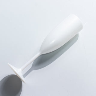 White champagne flute on a plain background