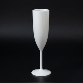 White champagne flute on a black background.