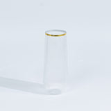 Clear ribbed glass vase with gold rim