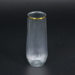 Elegant ribbed glass vase with a gold rim.
