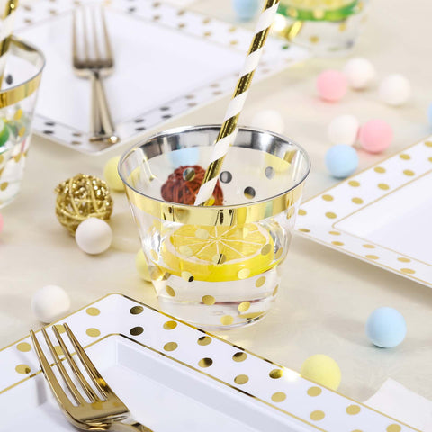 Clear plastic cup with gold polka dots and candy-filled table setting