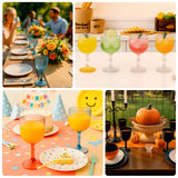 Colorful party drinks in elegant goblets on festive tables.