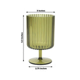 Green ribbed glass cup with a pedestal base, dimensions 3x2.75x5.5 inches.