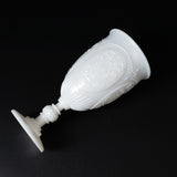 White decorative goblet with intricate detailing