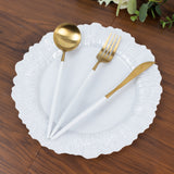 Elegant white plate with gold-accented cutlery set.