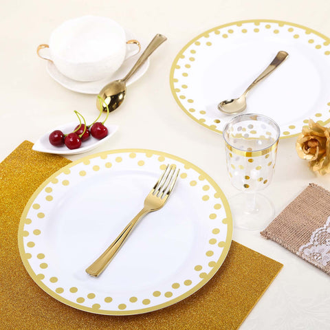 White plate with gold polka dots and gold flatware