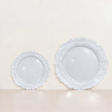 Set of two elegant white decorative plates on a neutral background