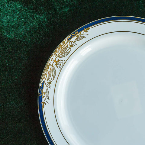 White plate with blue and gold floral rim