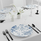 Elegant blue and white floral dinner plate on a beautifully set dining table.