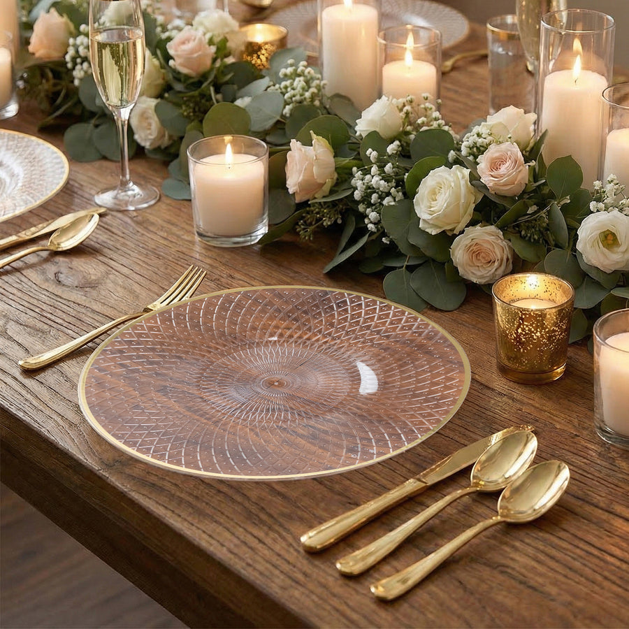 Elegant clear plate with gold trim on a beautifully set dining table.