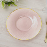 Pink decorative plate with textured design and gold rim.