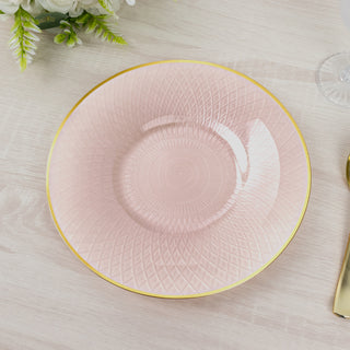 Pink decorative plate with textured design and gold rim.