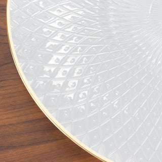 Elegant white decorative plate with textured design and gold rim.