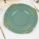 Elegant teal plates with gold accents, stacked on a table setting.