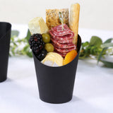 Charcuterie cup with cheese, salami, olives, and fruit