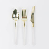 Gold disposable spoon, fork, and knife with clear handles on white background#whtbkgd