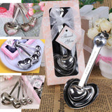 Heart-shaped stainless steel measuring spoons in a gift box.