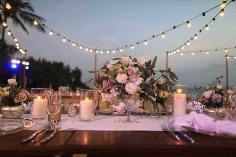 Wedding table with floral centerpiece and candles