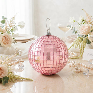 Pink disco ball ornament with floral table decor and pearls