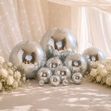Elegant silver disco balls with white roses in a dreamy wedding decor scene