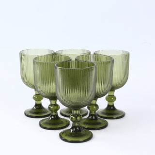 Set of 5 green ribbed glass goblets with stemmed bases
