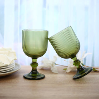 Green ribbed glass goblets on a dining table, elegant home decor display