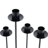 Black metal candle holders set on white background