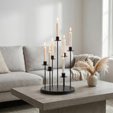 Modern living room with lit candle holder centerpiece on concrete coffee table