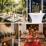 Gold candlesticks with candles on various dining tables and festive settings.