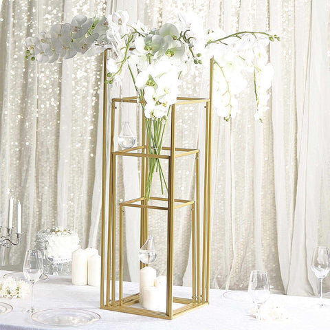 Gold tiered flower stand with orchids and candles