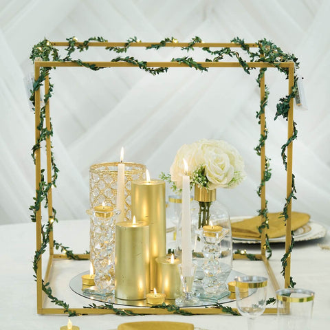 Gold square frame centerpiece with candles and white flowers