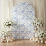 Floral backdrop with white flowers and candles in an elegant setting.