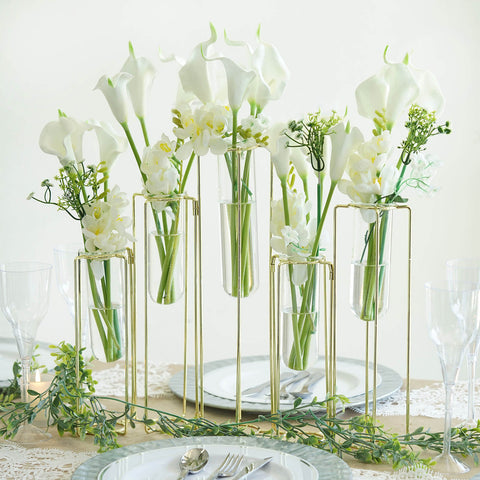 Tall glass vases with white flowers on a tablescape
