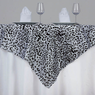 Add a Touch of Elegance to Your Jungle Theme Party with the Black/White Taffeta Leopard Print Table Overlay