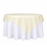 Yellow table overlay on a white tablecloth, perfect for events and dining.
