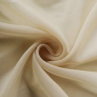 Light beige fabric with a soft, flowing texture.