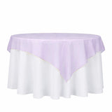 Lavender round tablecloth overlay on white table linen
